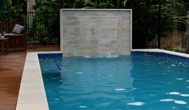 Water fall feature in a custom swimming pool
